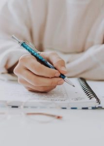 Woman writing by hand